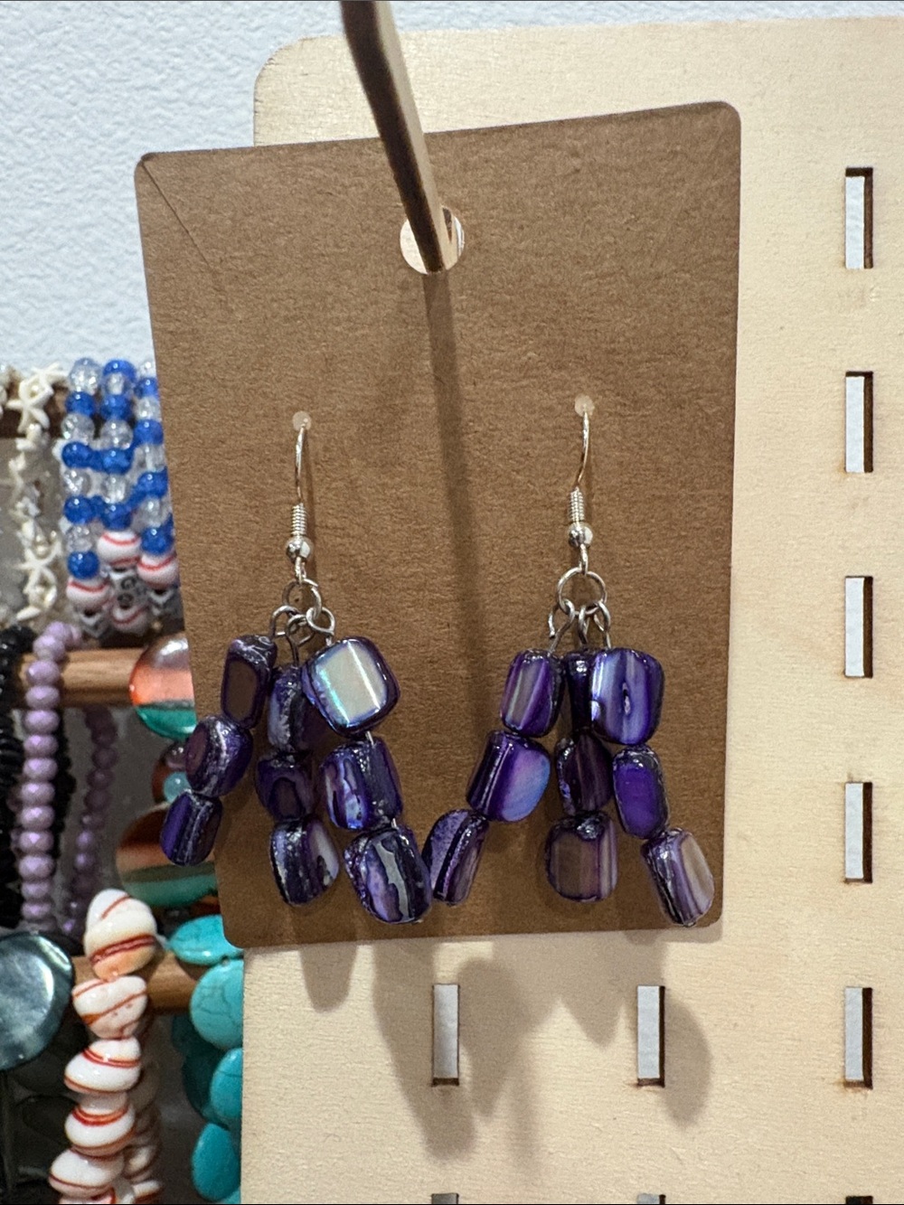 Handcrafted purple shell beads dangle earrings